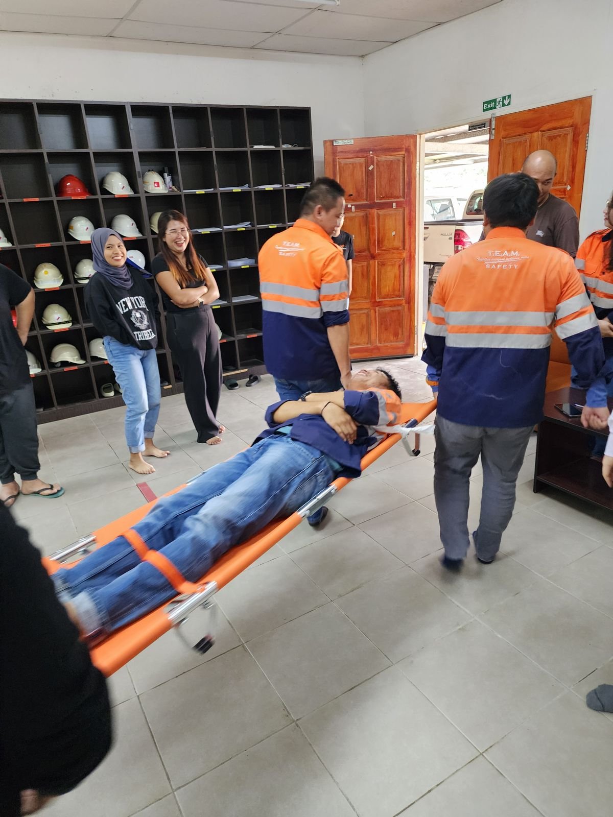 Trainees carrying a casualty on a stretcher during Day 2 of the BOFA-C course